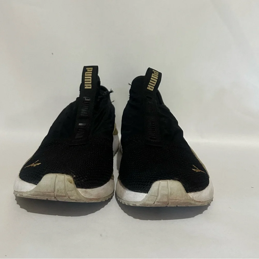 Puma Women’s Black and Gold Athletic Shoes
